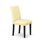 A Round Kitchen Table and Eggnog Faux Leather Chairs, Black